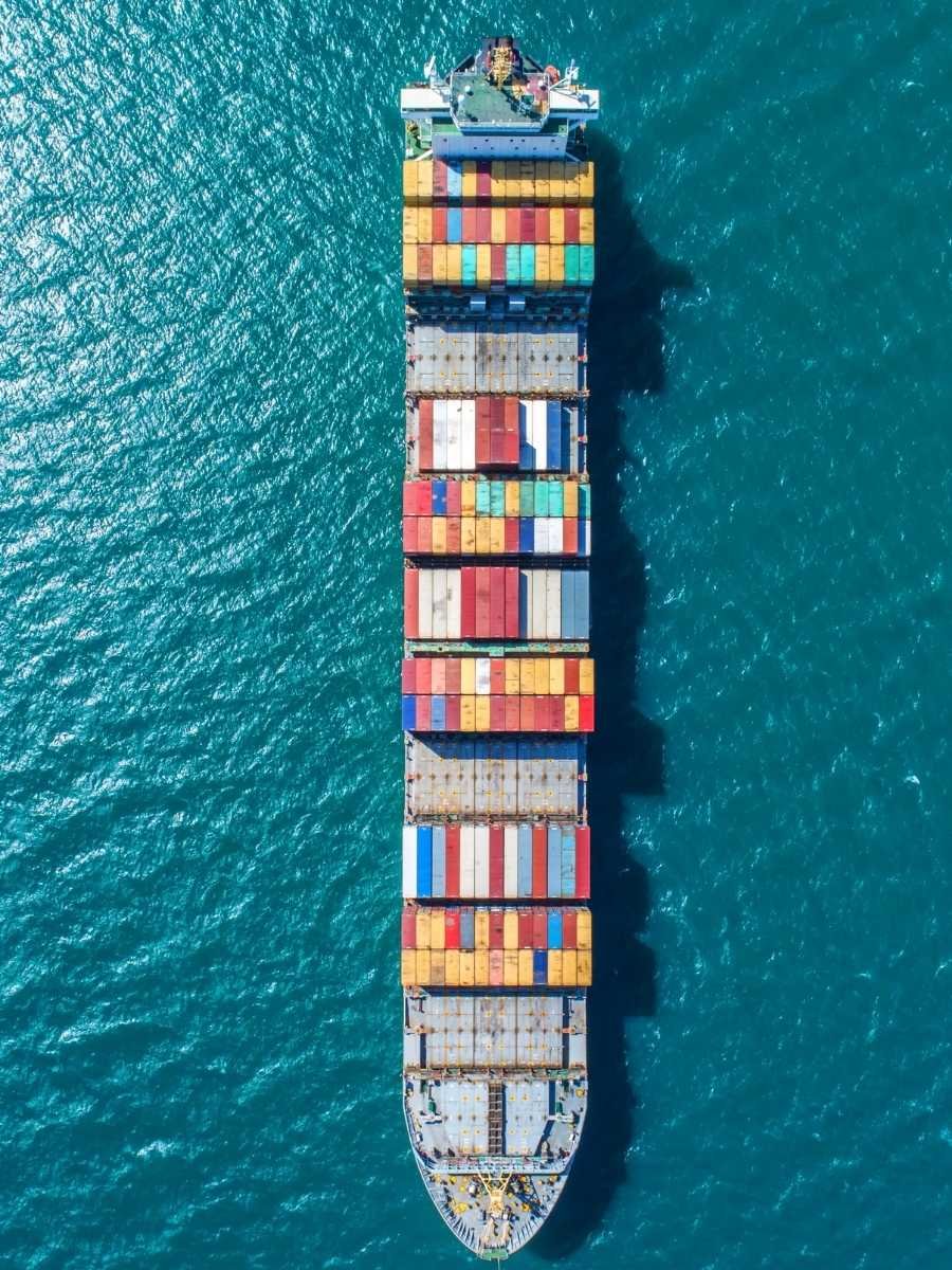 Cargo ship with containers on ocean